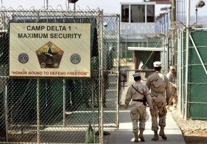 U.S. military guards walk within the Camp Delta military-run prison, at the Guantanamo Bay U.S. Naval Base, Cuba in 2006. / AP file photo